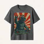 Retro Monster DJ Graphic T-Shirt Featuring a Headphone-Wearing Kaiju Spinning Vinyl Records in Streetwear Style